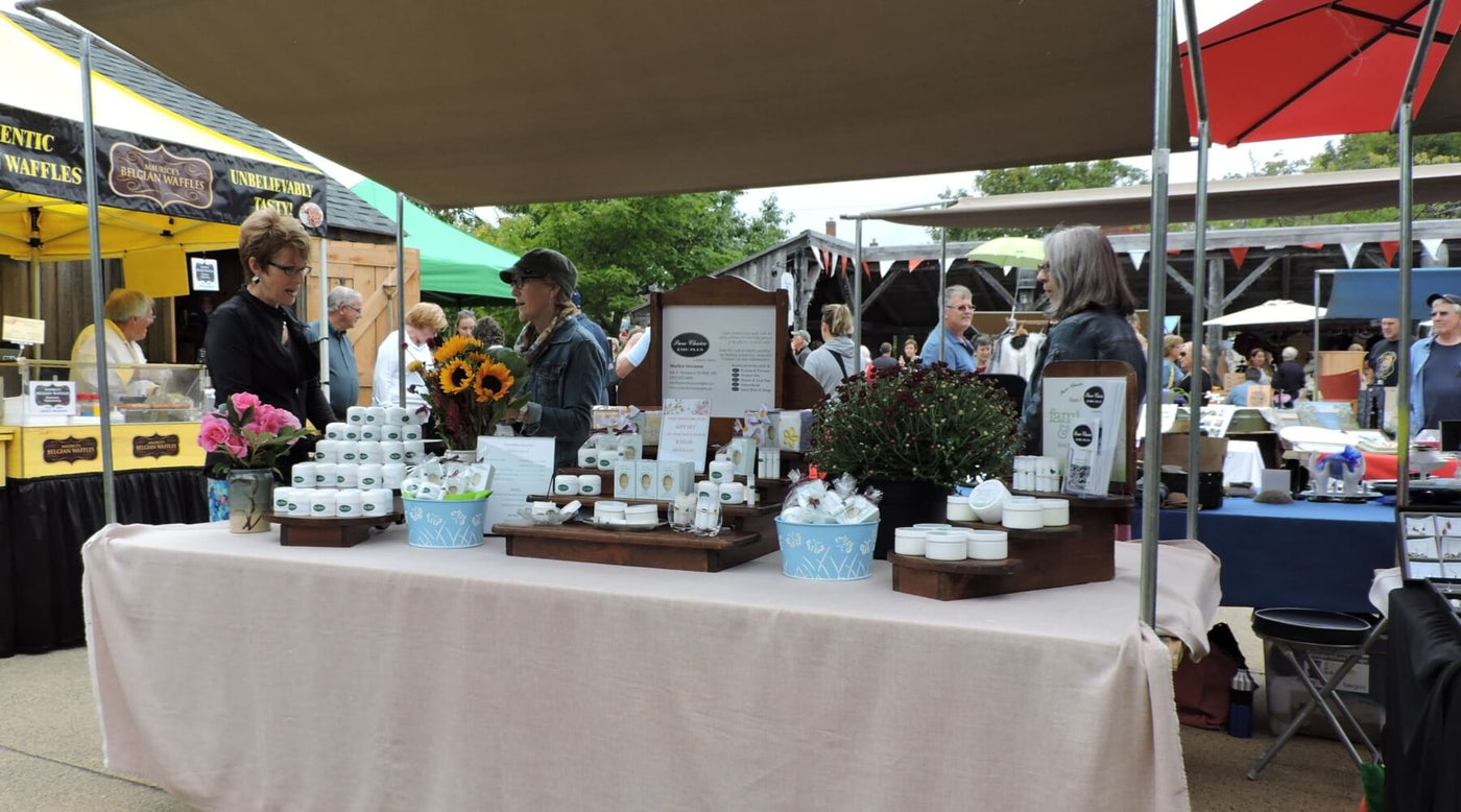 Marilyn speaking with a customer at the Annapolis Royal Farmers Market